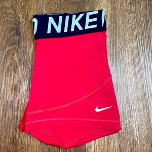 Red Nike Pro 5” shorts